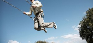 Business man on swing